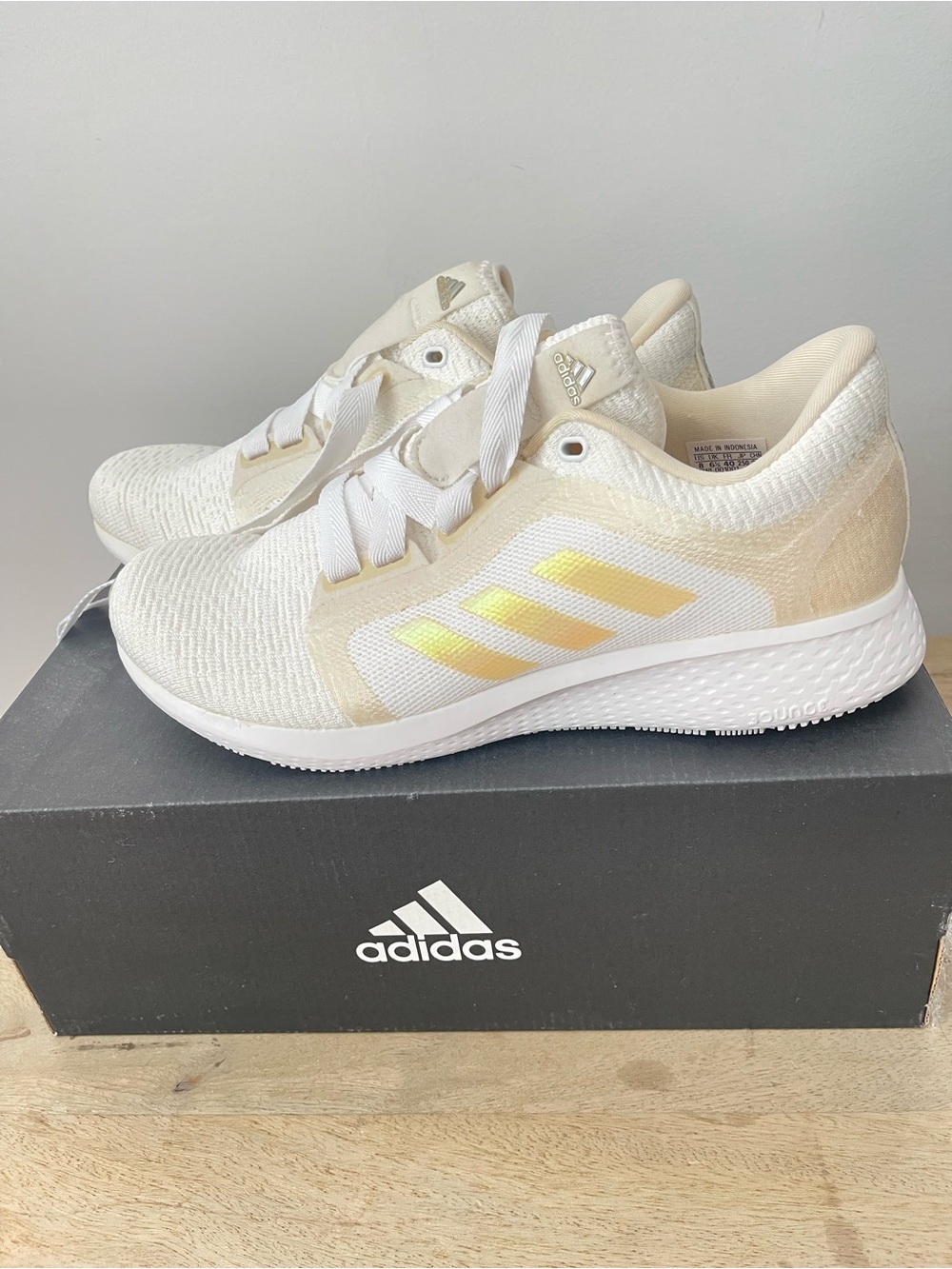 Adidas Women’s White Sneakers with Gold accent